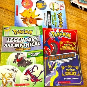 Bundle of three Pokémon handbooks and a guidebook